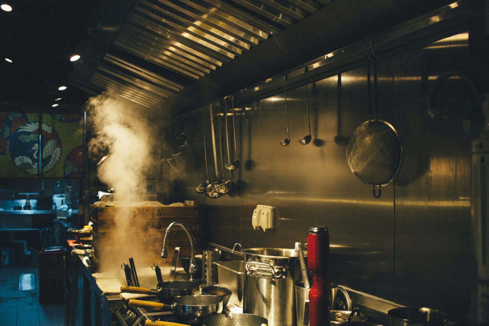 A commercial kitchen with stainless steel equipment